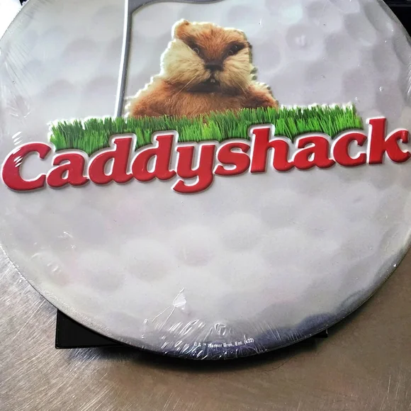 Open Road Brands Caddyshack Logo Golf Ball Round Metal Sign, 52 OFF
